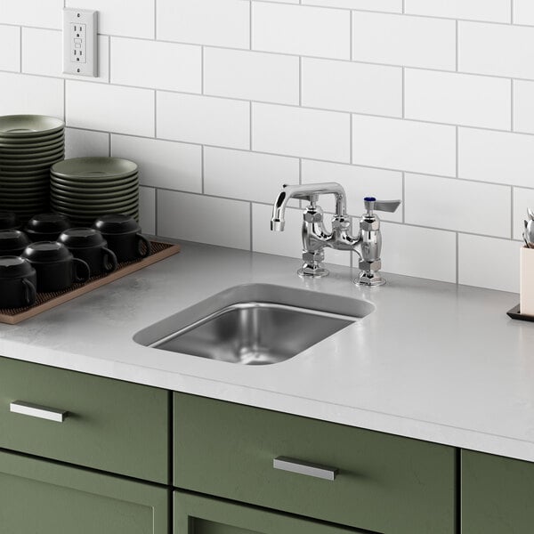 A close up of a Waterloo stainless steel undermount sink.