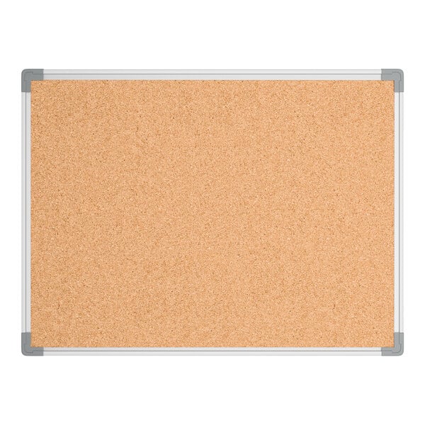 A rectangular cork board with an aluminum frame and gray corner protectors.