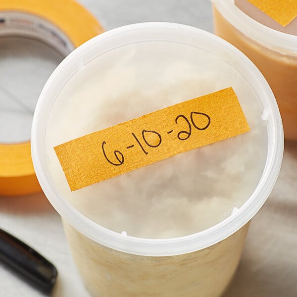 A container with an orange Shurtape label.