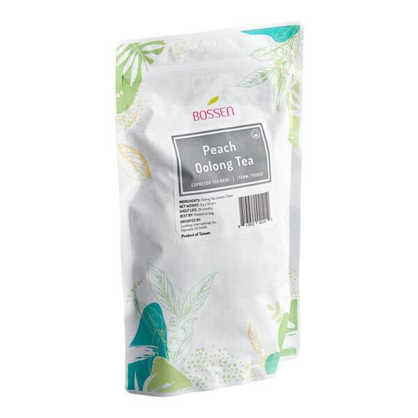 A white resealable bag with green and yellow leaf illustrations, labeled 'Bossen Peach Oolong Tea' with product details and a barcode on the front.