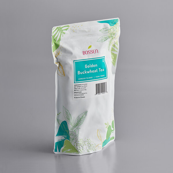 A Bossen Golden Buckwheat Ground Tea bag with green and blue designs and green leaves.
