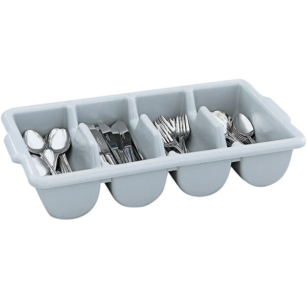 a stack of silverware in a kitchen