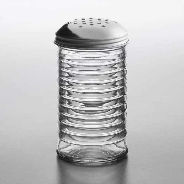 An American Metalcraft glass beehive cheese shaker with a stainless steel lid.