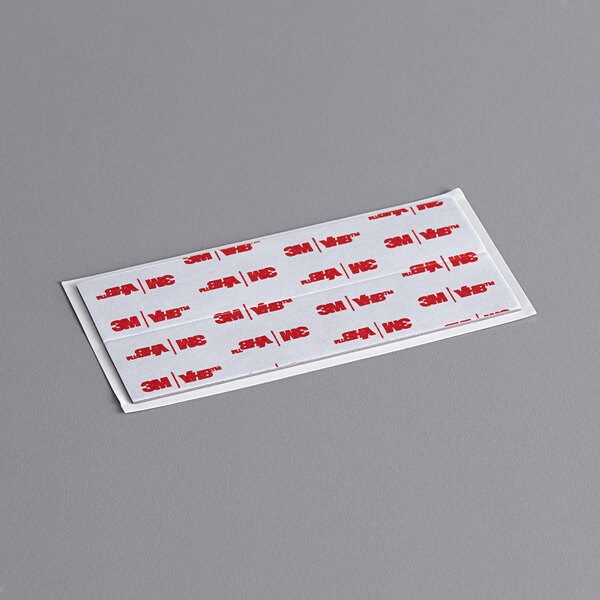 A white rectangular Steril-Sil hand sanitizer dispenser with red and white text on it.