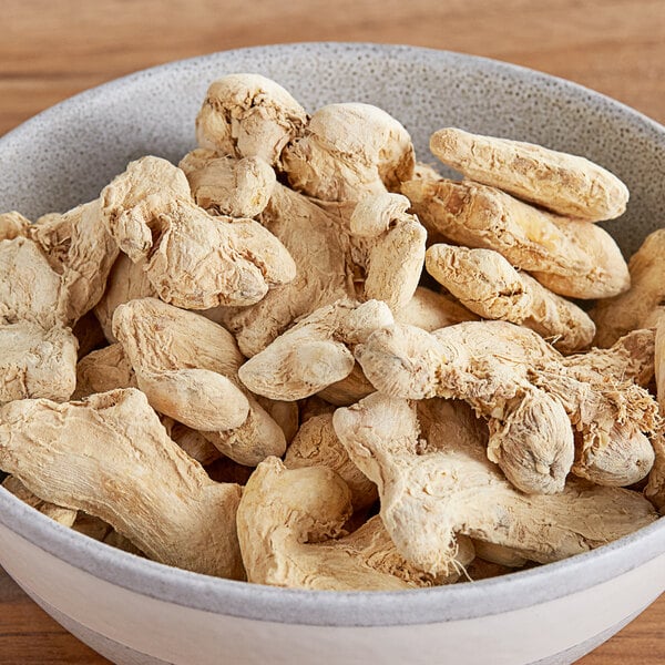 Unpeeled ginger in a clear container