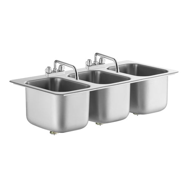 A stainless steel Regency drop-in sink with three bowls and two swing faucets.