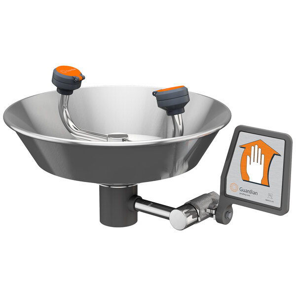 A close-up of a stainless steel bowl with an orange handle.
