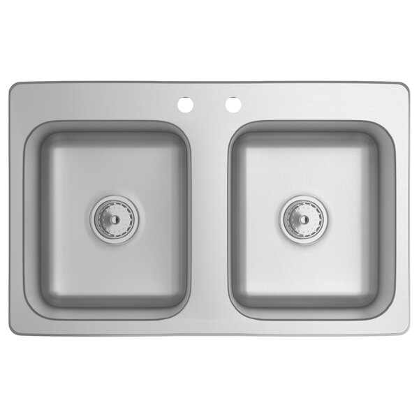 A close-up of a double compartment stainless steel drop-in sink.