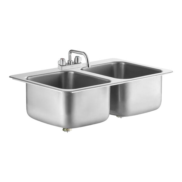 A stainless steel double sink with two compartments and a faucet.