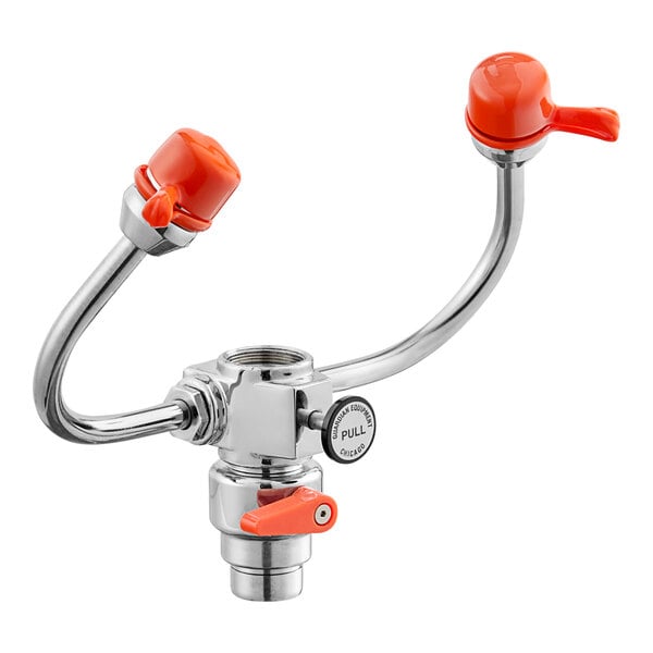 An orange and chrome metal faucet with two handles and an eyewash station attachment.