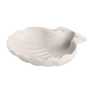 A white Hall China shell-shaped baking dish.