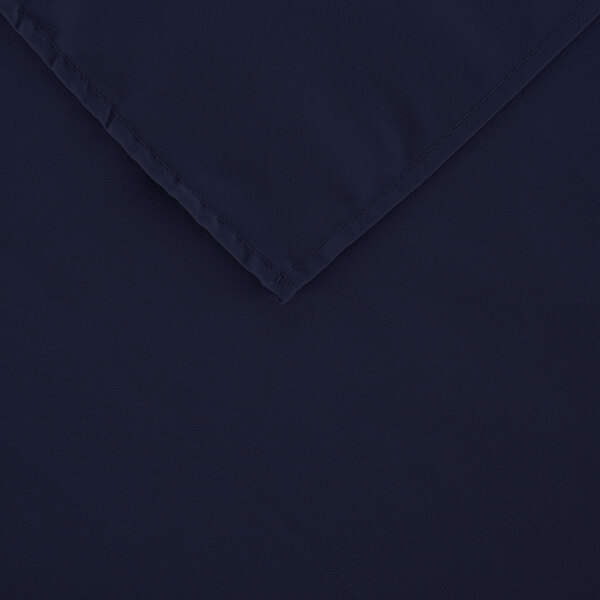 A navy blue rectangular cloth table cover with a folded edge.