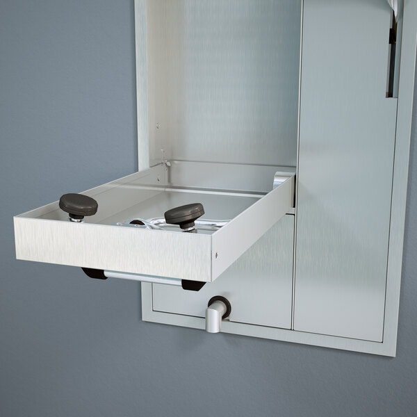 A Guardian Equipment recessed safety station with a drain pan and exposed shower head.