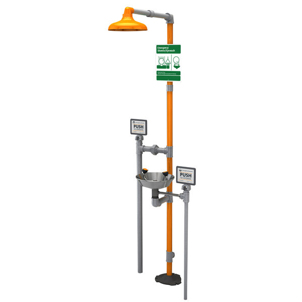 A Guardian Equipment stainless steel eye wash and shower station with a green and orange stand.