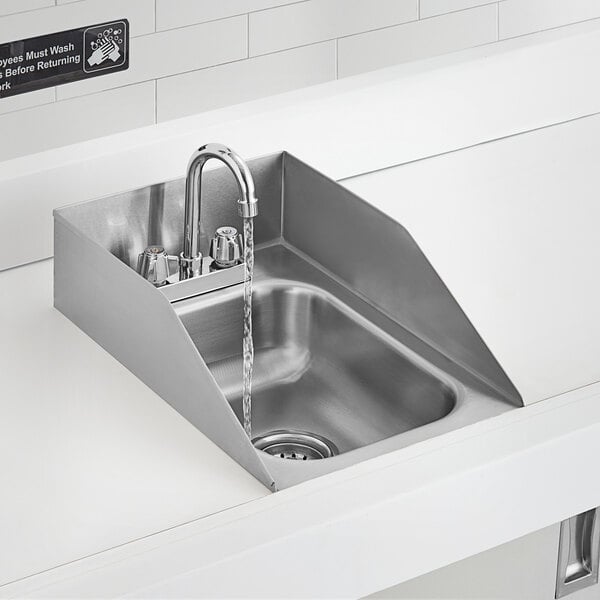 A Regency stainless steel drop-in sink with a gooseneck faucet and side splashes over a counter.