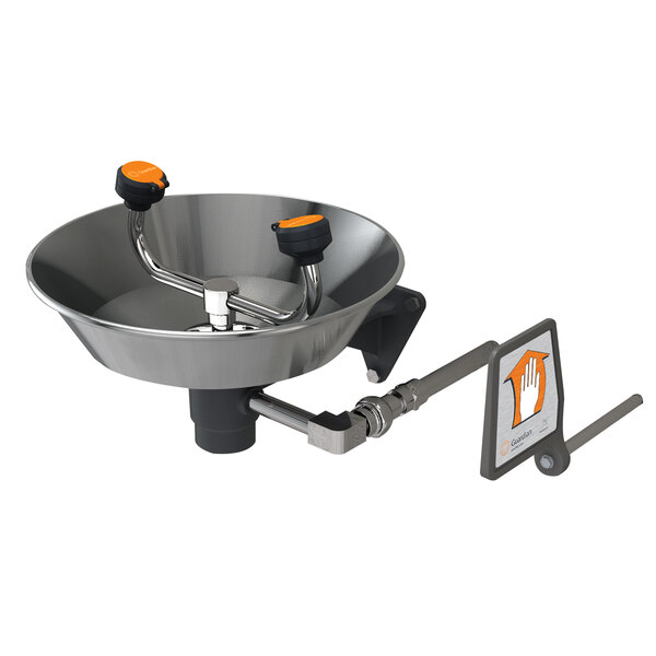 A Guardian Equipment wall mounted eye and face wash station with a stainless steel bowl and orange knobs.