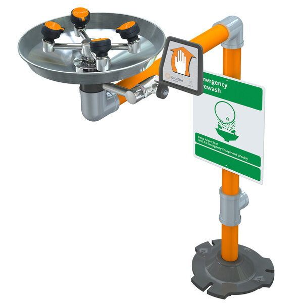 A Guardian Equipment pedestal mounted eye and face wash station with a sign above it.