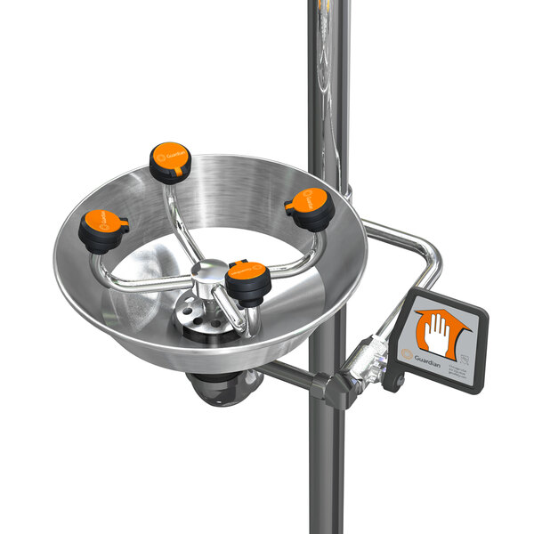 A polished chrome metal safety station with orange knobs and a metal bowl.