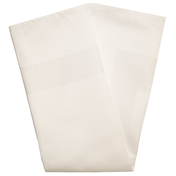 A folded cream cloth napkin with a white satin band.