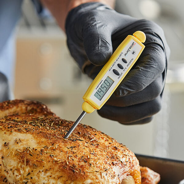 food thermometer being used