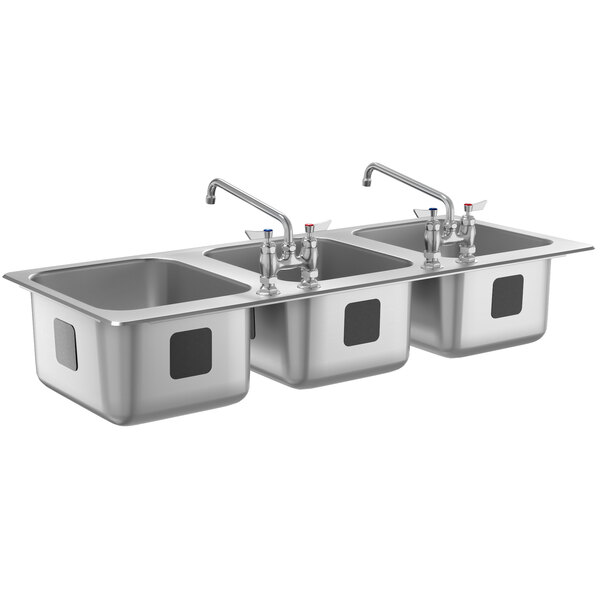A stainless steel Waterloo three compartment sink with two faucets.