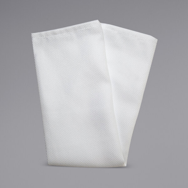 A folded white Milan Birdseye cloth napkin on a gray background.