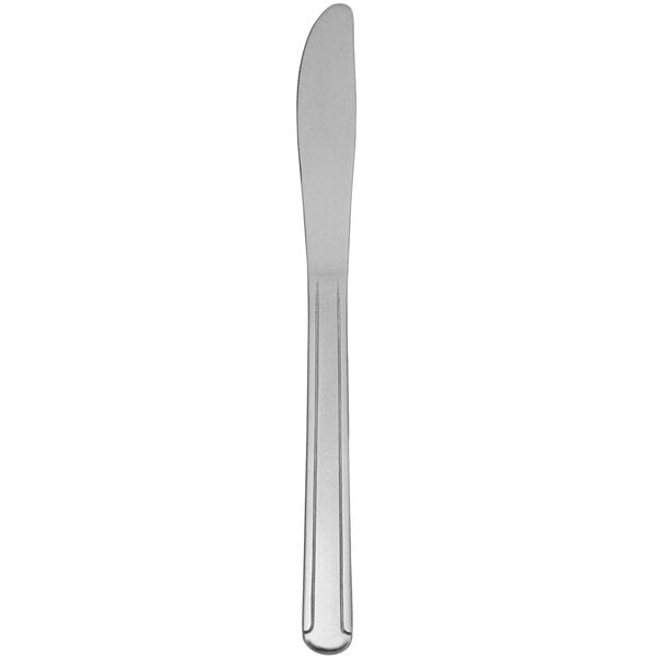 A Delco Heavy Dominion stainless steel dinner knife with a silver handle.