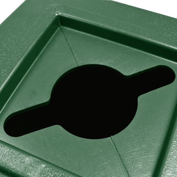 A green plastic trash can with a hole in it for mixed recycling.