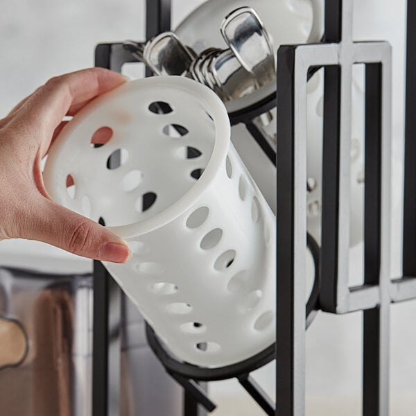 A person holding a white Tablecraft NY33 flatware cylinder