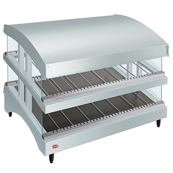 A white Hatco countertop food warmer with a curved glass top and two shelves.