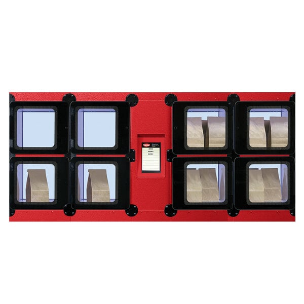 A red Hatco Flav-R 2-Go machine with black frames and a few boxes.