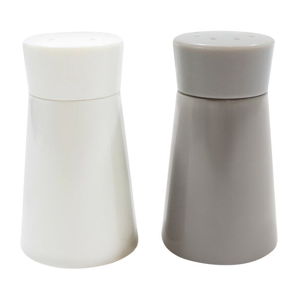 A white Tablecraft Crofthouse salt and pepper shaker set with round tops.