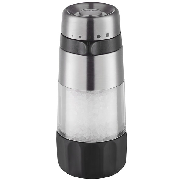 An OXO salt grinder with a black and silver lid.