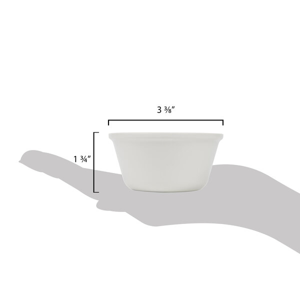 A hand holding a small white Thunder Group melamine ramekin.
