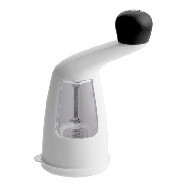A white and black OXO Good Grips radial pepper grinder with a clear window to view the contents.