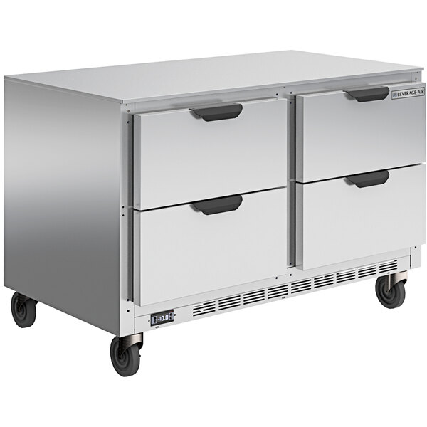 A stainless steel Beverage-Air undercounter freezer with four drawers.