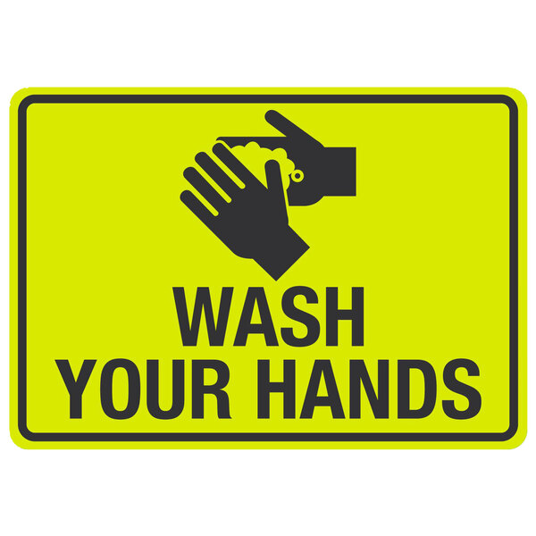 A yellow wash your hands sign with black text and a hand washing symbol.