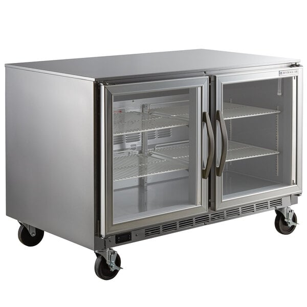 A stainless steel Beverage-Air undercounter freezer with two glass doors.