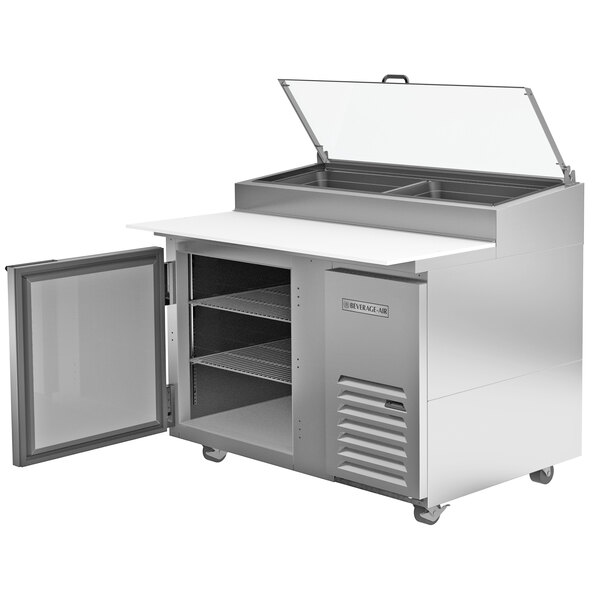 A Beverage-Air stainless steel refrigerated pizza prep table with a clear glass lid open.