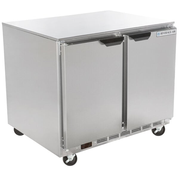 a silver refrigerator on wheels