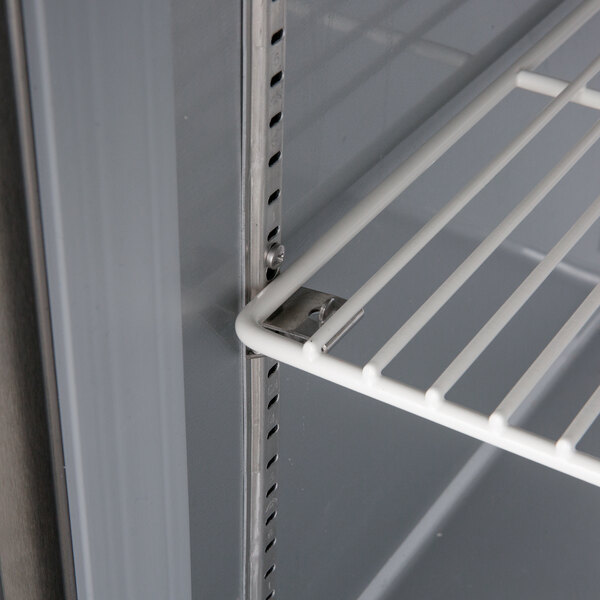 A white metal shelf in a Beverage-Air undercounter freezer.