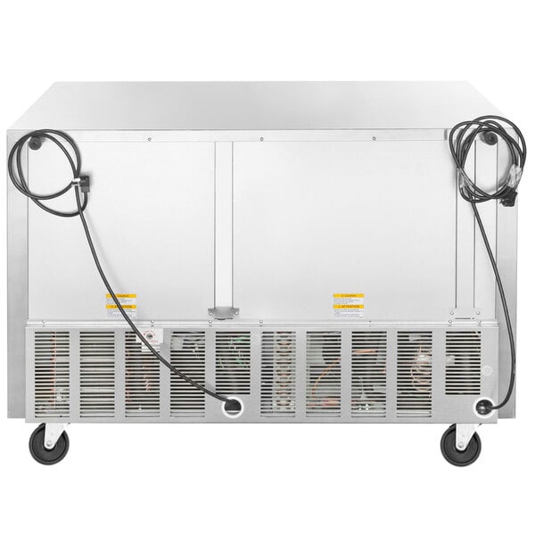 A stainless steel Beverage-Air undercounter refrigerator/freezer with a hose and wires.