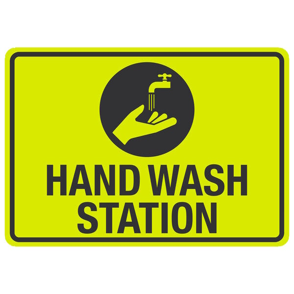 a sign with a hand washing