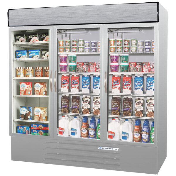 A Beverage-Air stainless steel marketmax refrigerator with glass doors filled with various types of products.