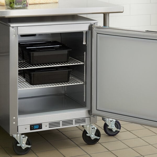 A Beverage-Air undercounter freezer with a door open on a counter.