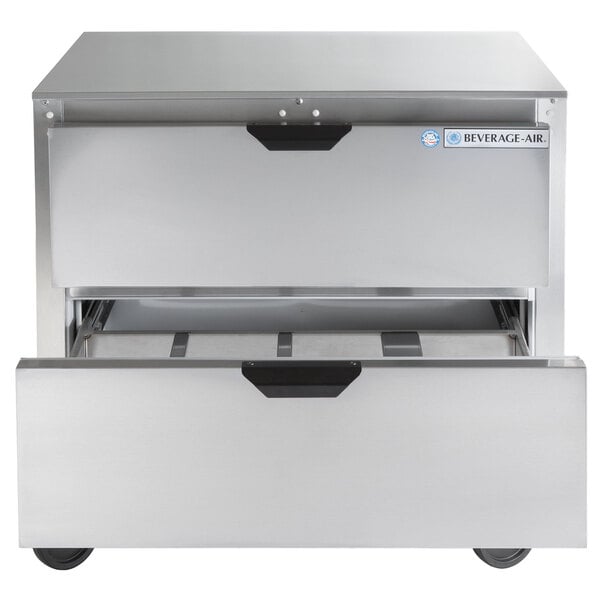 a silver refrigerator with a drawer