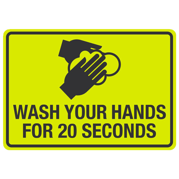 A yellow sign with black text reading "Wash your hands for 20 seconds" and a symbol of hands washing.
