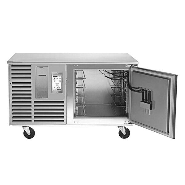 A Traulsen stainless steel undercounter blast chiller with a door open.