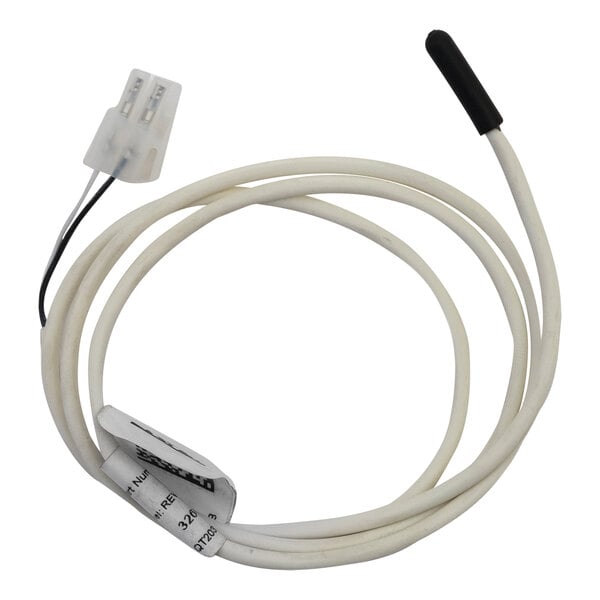 A white cable with a white plug and a black connector on a Heatcraft temp sensor.