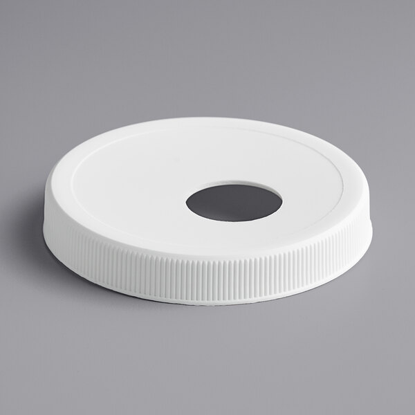A white plastic Tablecraft lid with a hole in the center.